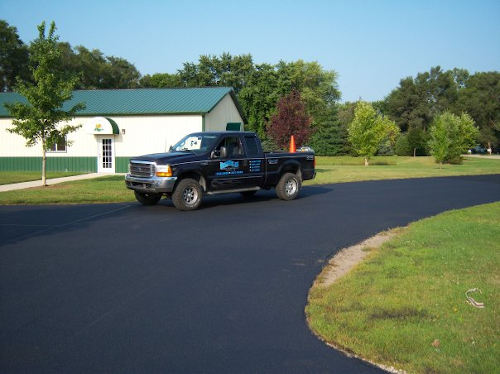 New sealcoating on a driveway in Aurora, IL