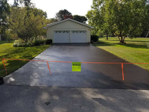 Sealcoating a driveway in Chicago Western Suburbs
